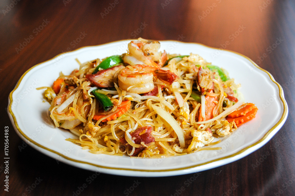 Stir-Fried Noodles, Thin rice noodles with shrimp, BBQ pork, bell peppers, onions, eggs, carrots & bean sprouts.