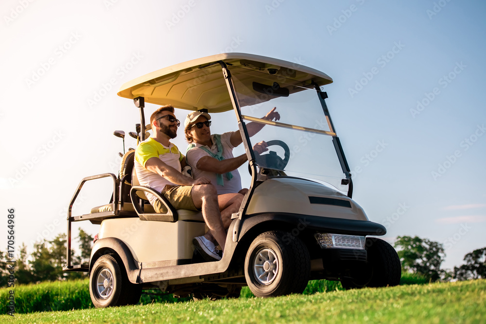 Men playing golf