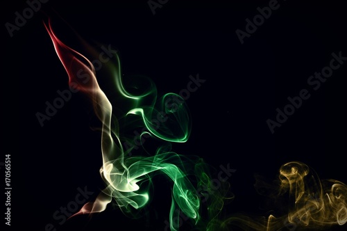 Fototapeta Naklejka Na Ścianę i Meble -  Abstract color smoke on black background, smoke background,red and green and brown ink background, red ,green, brown