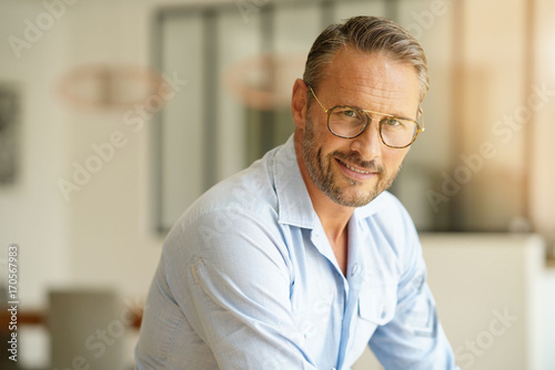 Handsome mature man with eyeglasses looking at camera