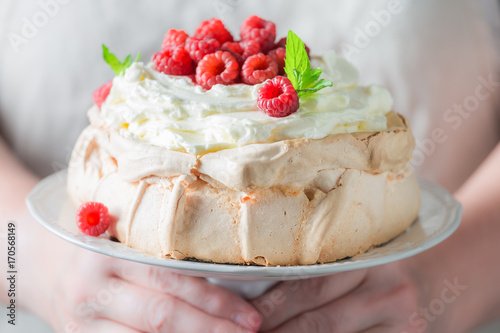 Homemade and rustic Pavlova cake with berries and meringue
