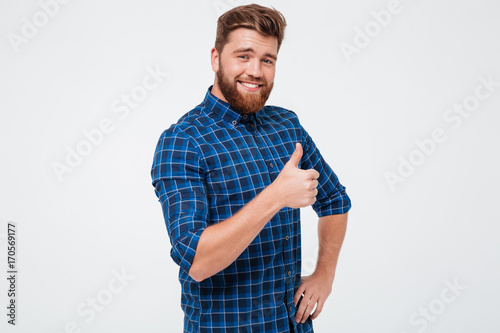 Positive man showing thumb up isolated photo