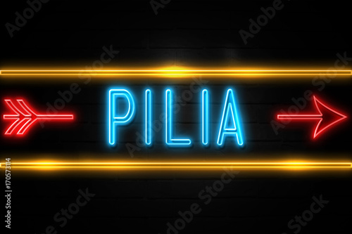 Pilia - fluorescent Neon Sign on brickwall Front view