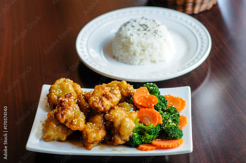 Sesame Chicken, Lightly breaded chicken with broccoli, carrots and sesame seeds. Sesame Chicken, Lightly breaded chicken with broccoli, carrots and sesame seeds.