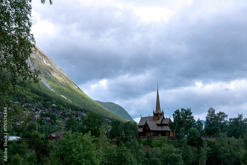 Obraz premium Norwegian old wooden traditional stave church in Lom, Norway