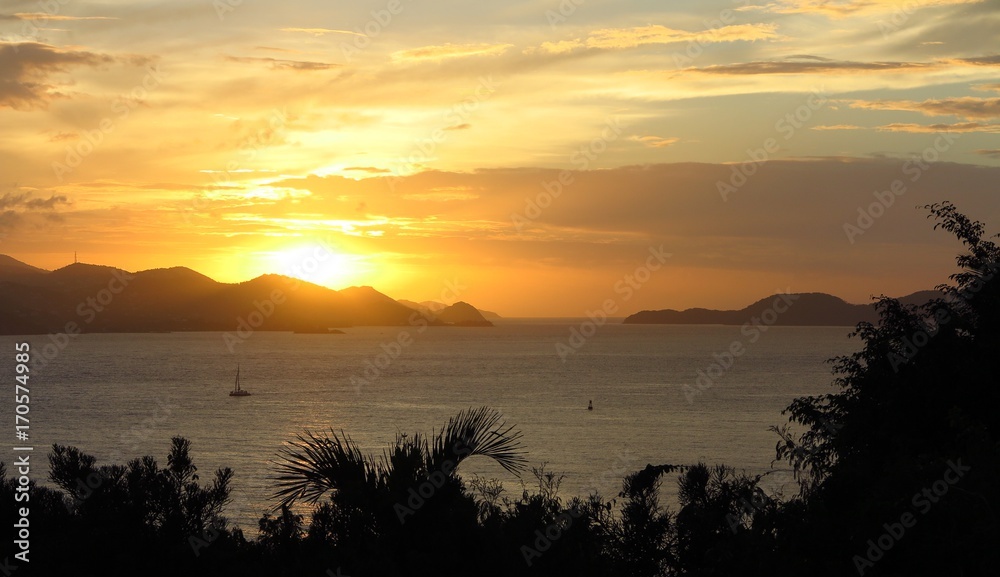 sunrise sunset over distant islands