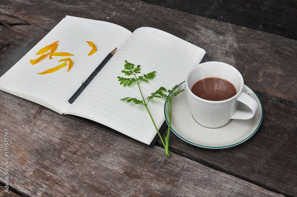 Cup of hot coffee on a wooden,