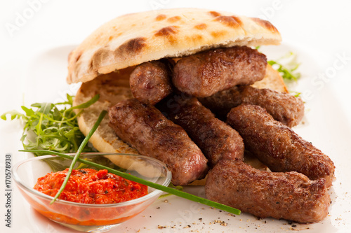 photo of Cevapi, cevapcici, traditional  Balkan food - delicius minced meat photo