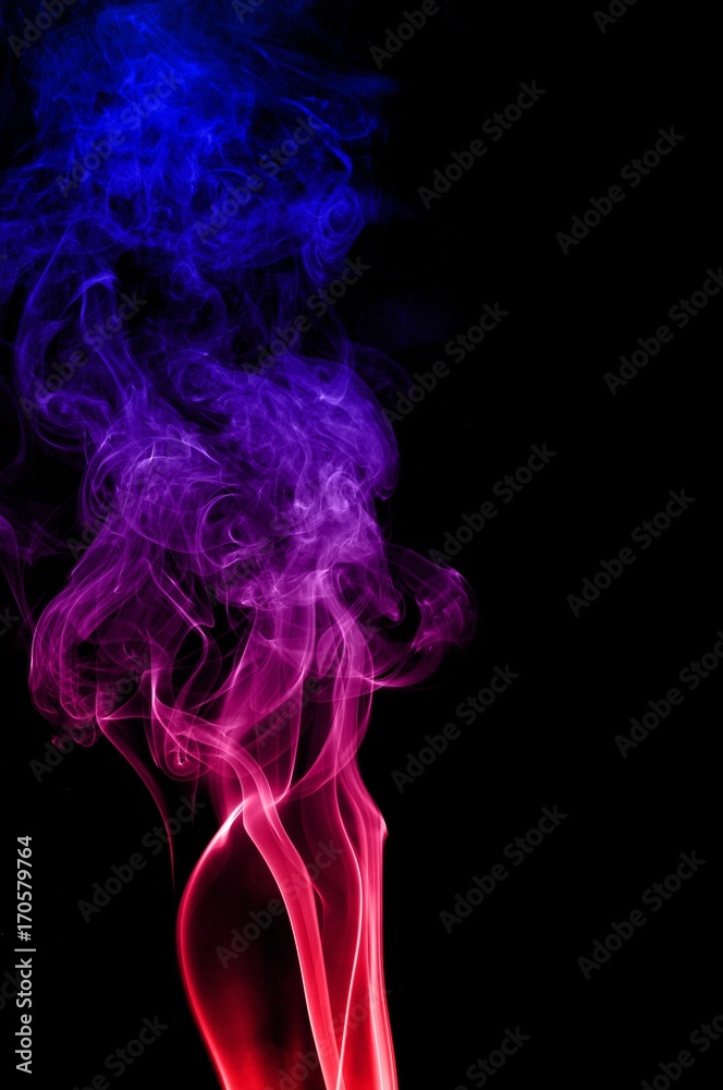 Obraz premium Movement of smoke,Red and blue smoke swirl on black background, Color smoke on black background