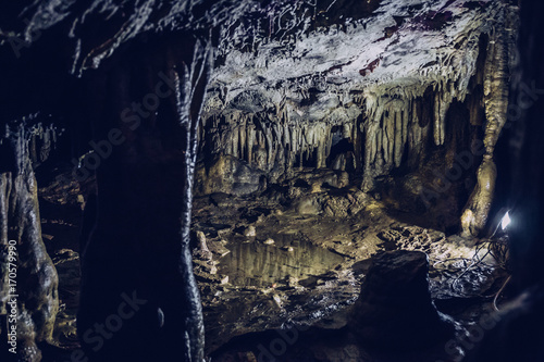 ancient beautiful gloomy cave with stalactites and stalagmites