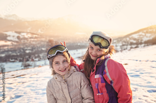 Happy friends have fun on the snow