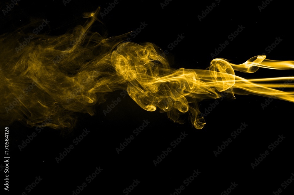 Gold smoke on black background,movement of gold smoke, Abstract gold smoke  on black background, gold background,gold ink background,yellow smoke,Glittering  gold smoke tail Stock Photo | Adobe Stock
