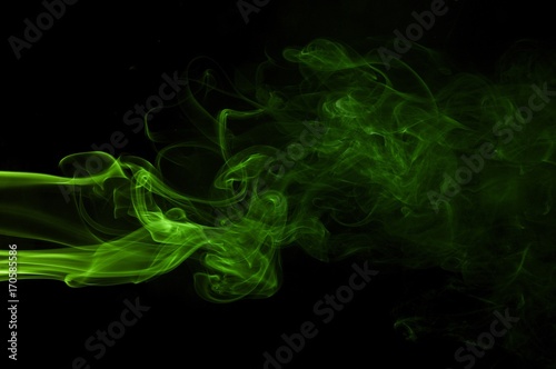Green colored smoke on a black background, abstract cloud. Smoke design,Abstract green lighting,Green Smoke