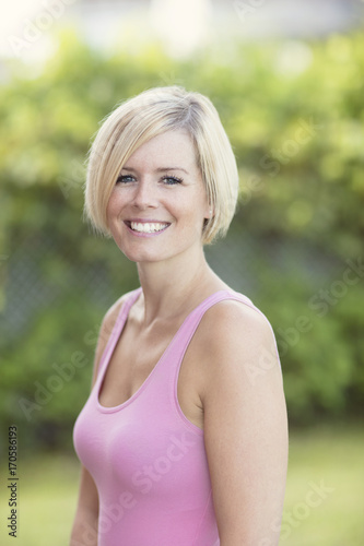 Close Up Of A Happy Blond Woman Smiling And Looking At the Camera. Thirties.