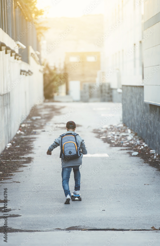 Young man with backpack and skateboard