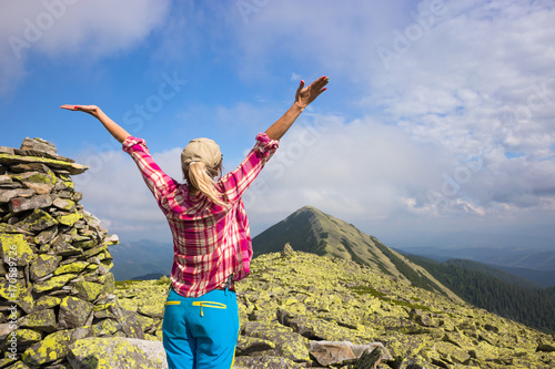 Happy hiker enjoy beautiful mountains. Relax summer time