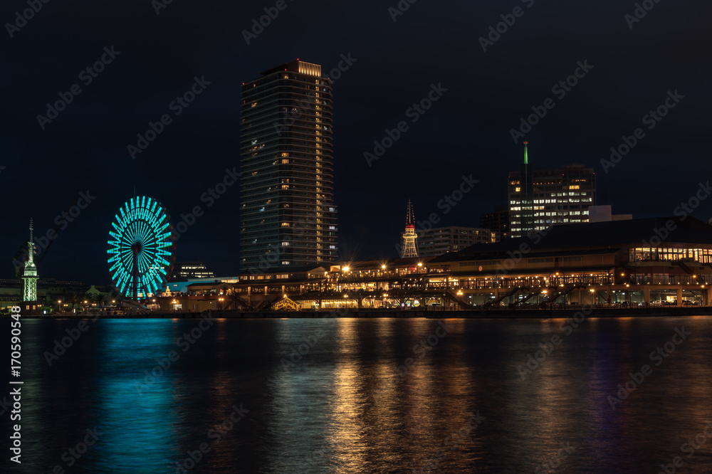 Beautiful view of Kobe Port.Night scenery of  Bay Area in Kobe City, with Landmark Tower among high rise skyscrapers with a giant Ferris wheel