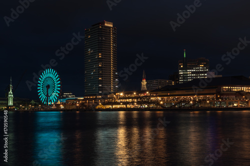 Beautiful view of Kobe Port.Night scenery of Bay Area in Kobe City, with Landmark Tower among high rise skyscrapers with a giant Ferris wheel