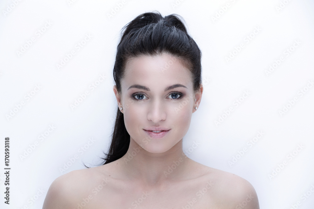 close-up portrait of a young woman's face. close-up portrait of a young woman's face.