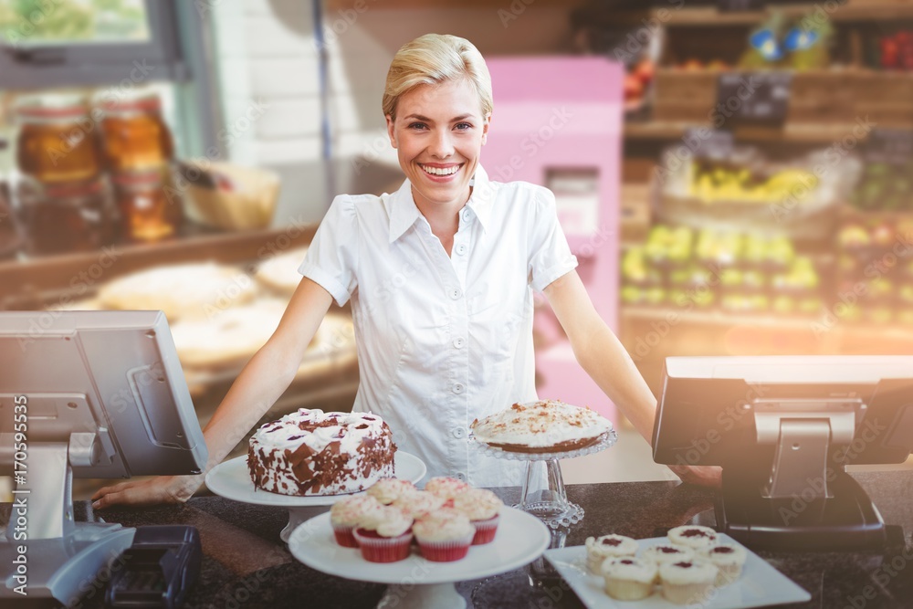 Composite image of portrait of female owner standing at counter
