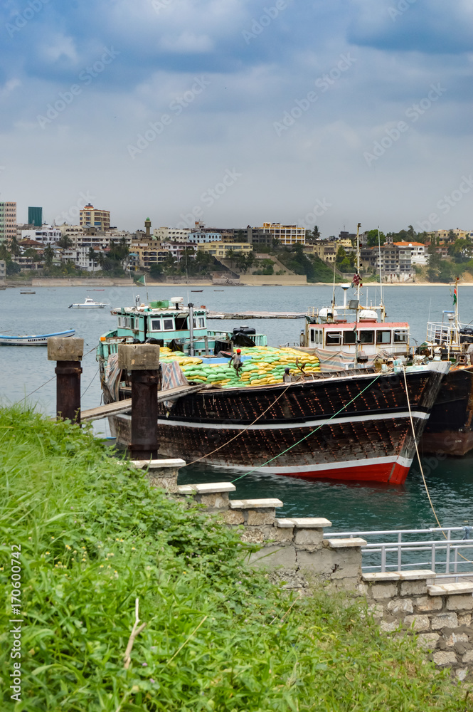 Fototapeta premium Boat loaded with bags in the port of Mombasa