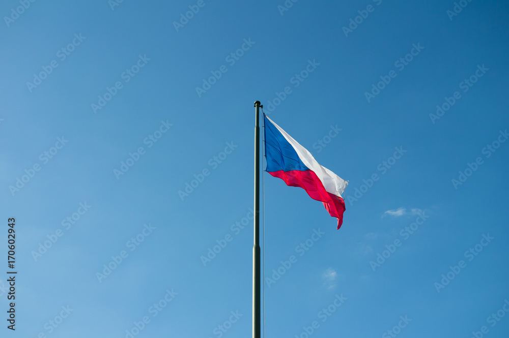 National flag of the Czech Republic. Symbol of country, state and nation is waving on the pole. Clear blue sky in the background National flag of the Czech Republic. Symbol of country, state and nation is waving on the pole. Clear blue sky in the background
