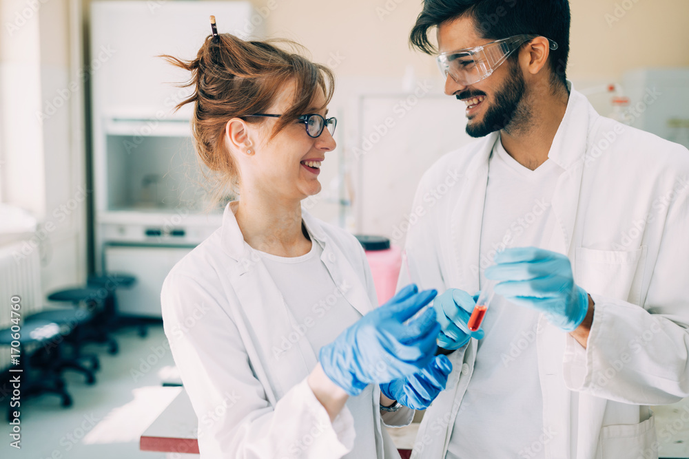Young students of chemistry working in laboratory Young students of chemistry working in laboratory