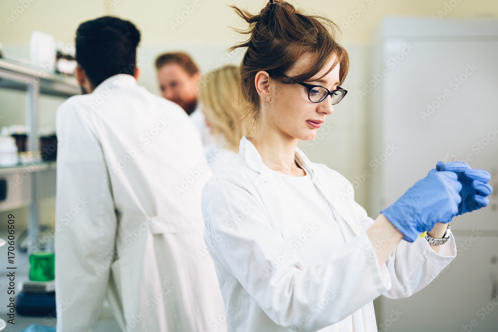 Female student of chemistry working in laboratory Female student of chemistry working in laboratory
