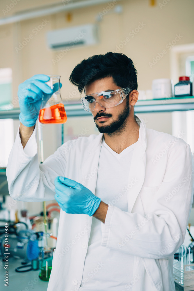 Male student of chemistry working in laboratory Male student of chemistry working in laboratory