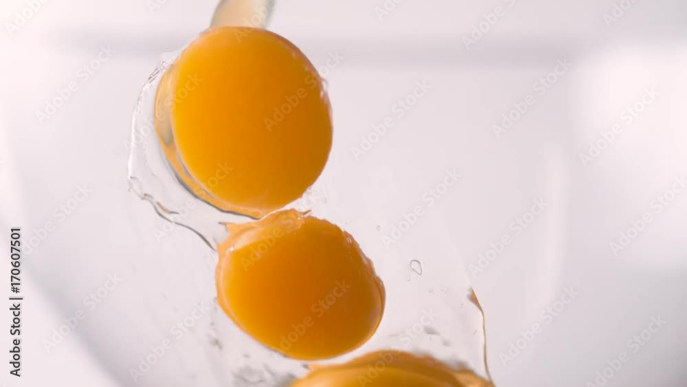 Eggs put in a bowl. Shot with high speed camera, phantom flex 4K. Slow Motion. Eggs put in a bowl. Shot with high speed camera, phantom flex 4K. Slow Motion.