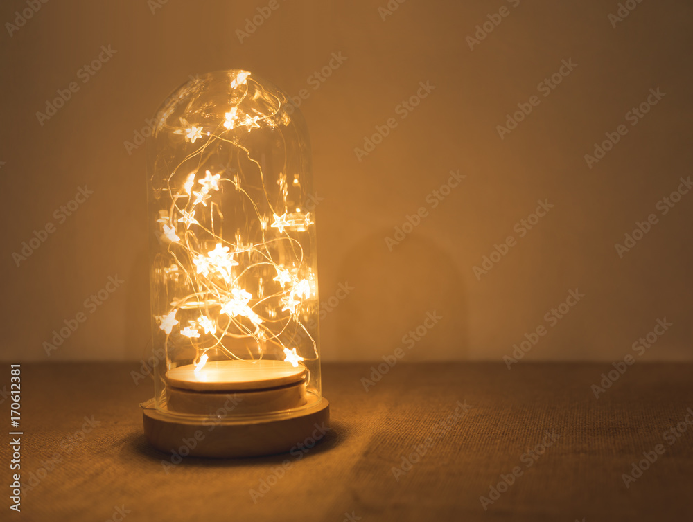 Warm led star in glass bottle with copy-space for background