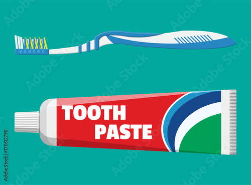 Toothbrush, toothpaste in tube photo