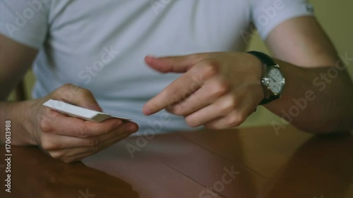 Man throws playing cards in slow motion photo