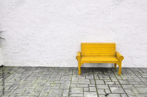 yellow chair on white background,red Chair wooden on white wall © Athipat