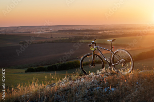 Fototapeta Naklejka Na Ścianę i Meble -  Sunrise, sunset, Cycling around the world Is a journey to freedom.