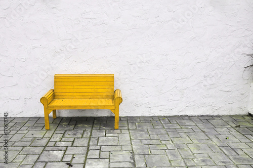 yellow chair on white background,red Chair wooden on white wall © Athipat