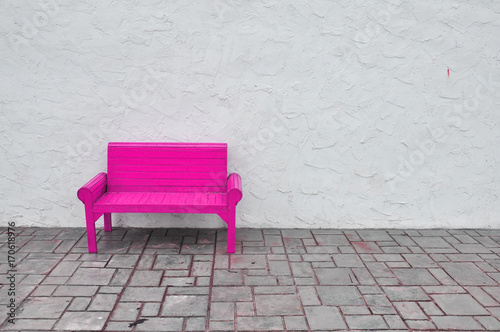 pink chair on white background,red Chair wooden on white wall © Athipat