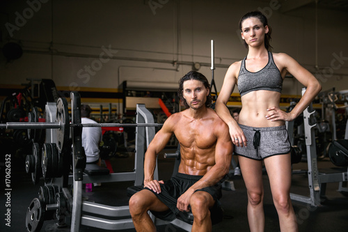 Attractive model couple with perfect bodies stand proud and confident  successful during workout