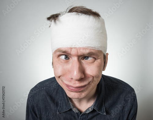 Man with bandage on his head