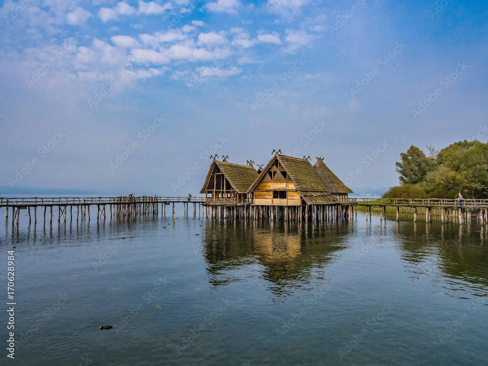 Fototapeta premium Reconstructions of prehistoric pile dwellings, Pfahlbaumuseum Unteruhldingen, Germany