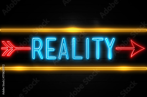 Reality - fluorescent Neon Sign on brickwall Front view