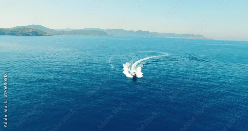 Aerial view of couple and yacht in wonderful beach Aerial view of couple and yacht in wonderful beach