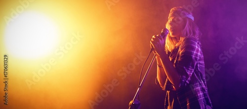 Singer performing at concert 