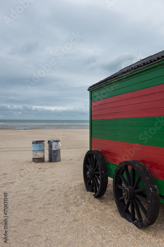 Vintage red and green striped beach cabin in De Panne, Belgium. photo