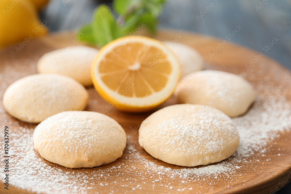 Homemade cookies with lemon flavor on wooden board