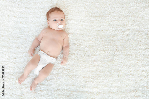 Cute little baby lying on s...