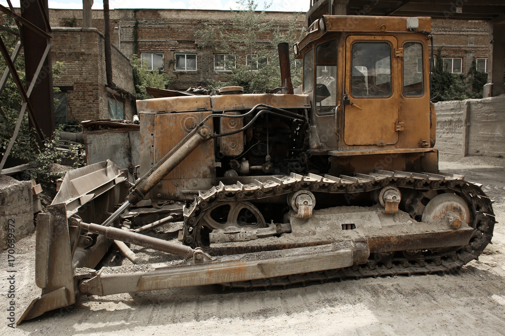 Bulldozer on the territory of concrete batching plant