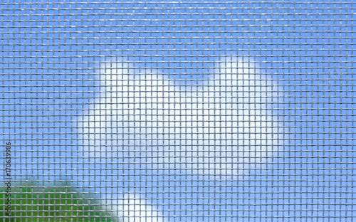 View of sky through window screen, close up