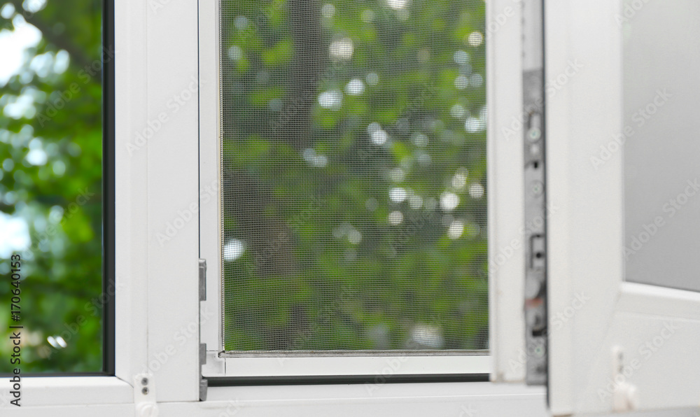 Fototapeta premium Window with mosquito screen indoors