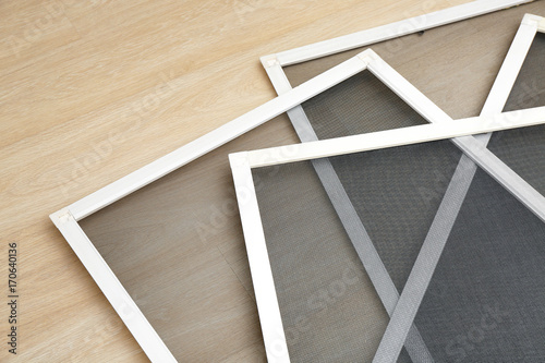 Mosquito window screens on floor